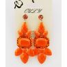 Earrings to pendants studded with stones and rhinestones, orange